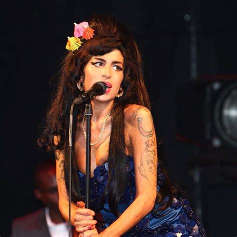 amy winehouse nip slip|Amy Winehouse cuddles up to mystery hunk as she flaunts her。